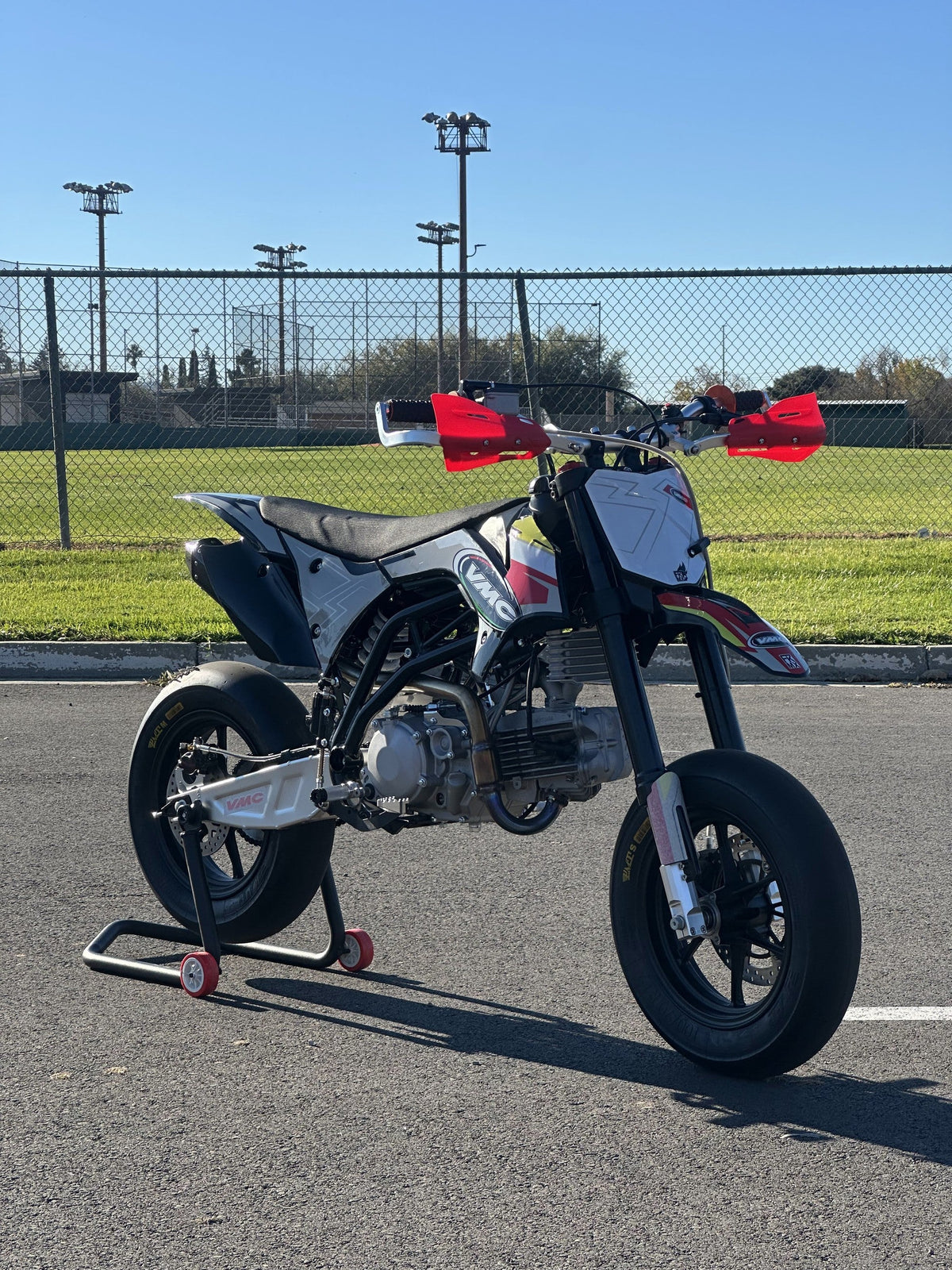 2025 VMC MT-01 Motard, side view on a paddock stand at a kart track